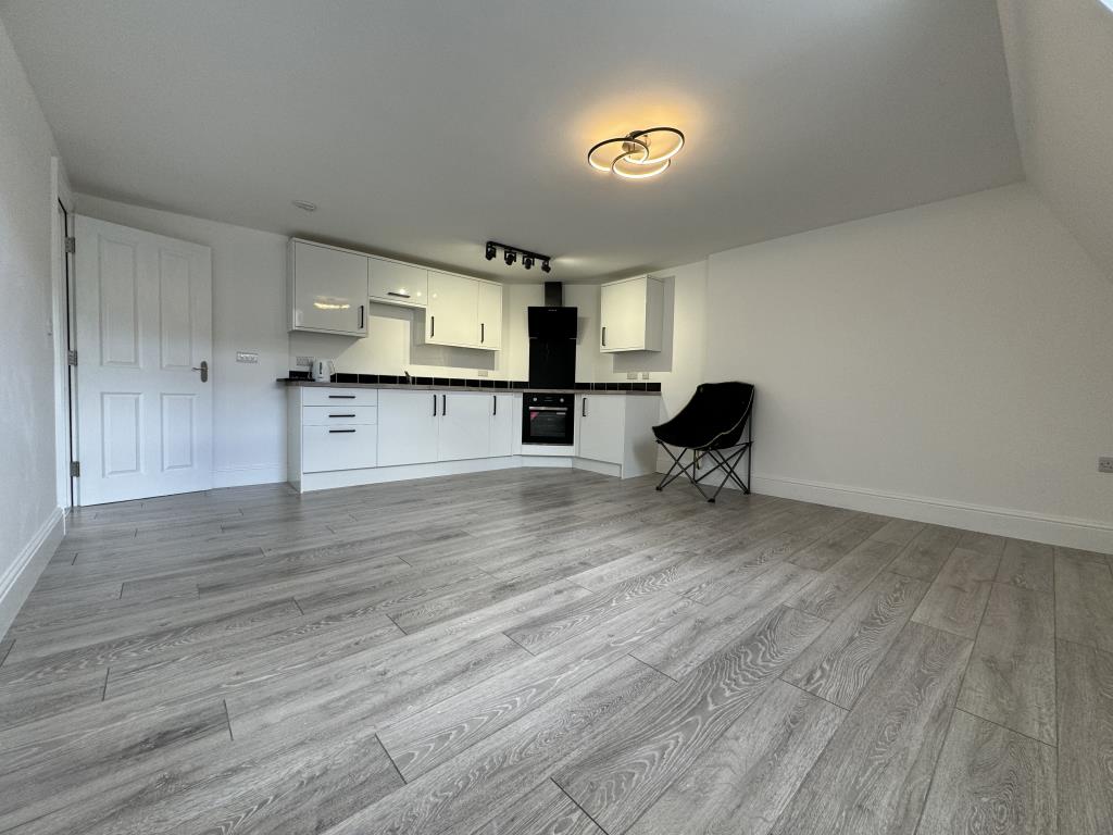 Lot: 161 - TWO-BEDROOM TOP FLOOR FLAT IN CENTRAL LOCATION - Living room/kitchen and dining room